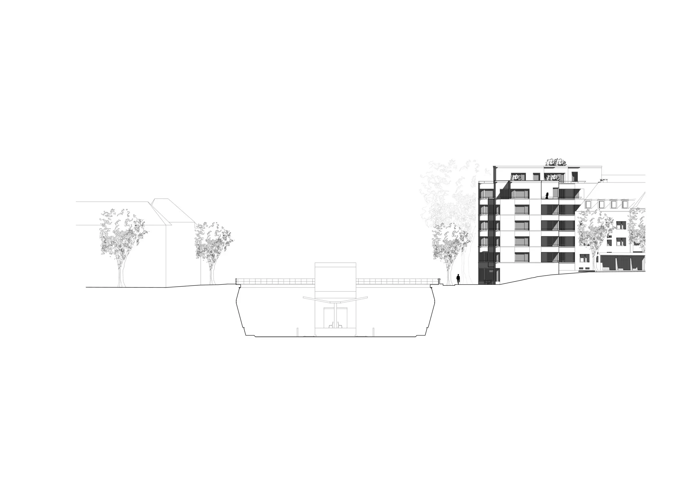 Ansicht mit dem freistehenden Neubau und der abgesenkten Verkehrsschneise im Vordergrund